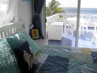 Master bedroom opening onto spacious balcony and glorious seaview.