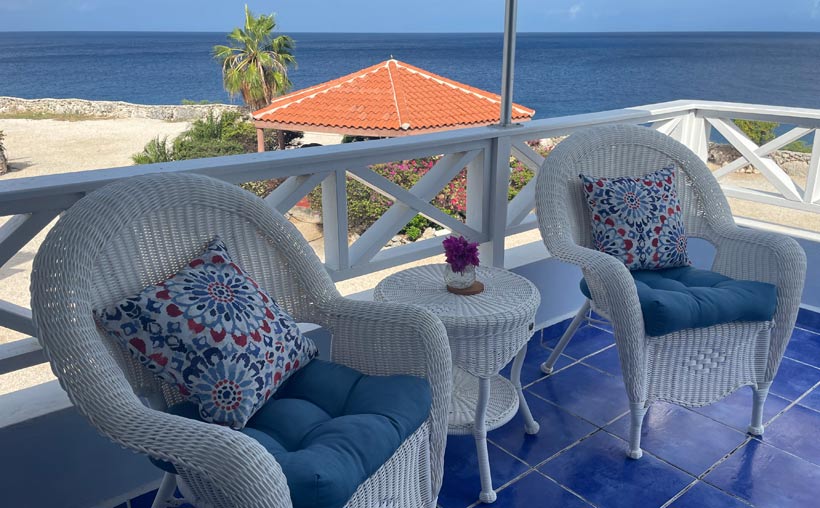 Balcony overlooking sparkling Caribbean Sea